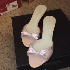 Pink kitten heels with cute ribbon detail.